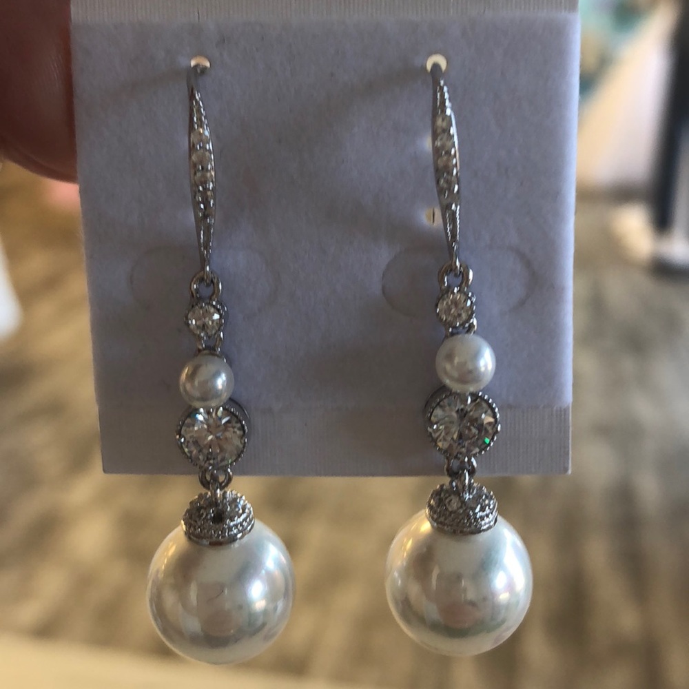 Pearl and rhinestone dangly earrings.